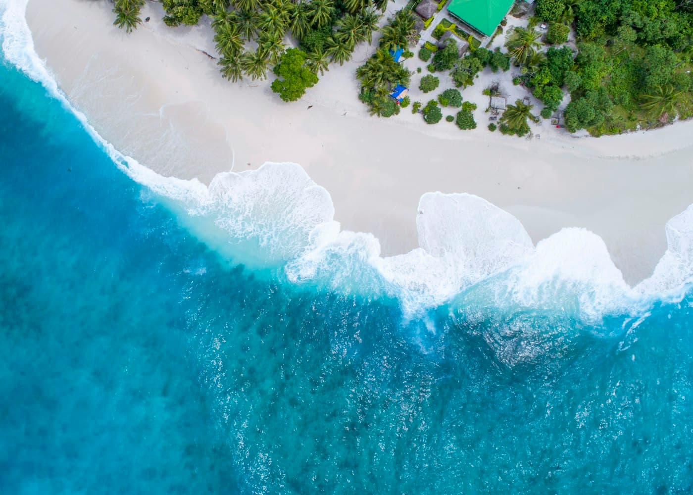 A turquoise coastline seen from above